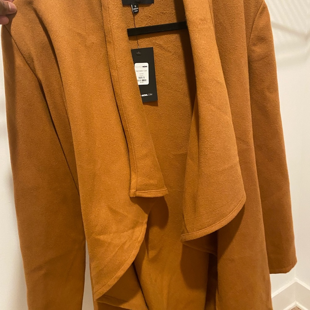 Fashion Nova trench coat beautiful color and fabric never worn with tags.